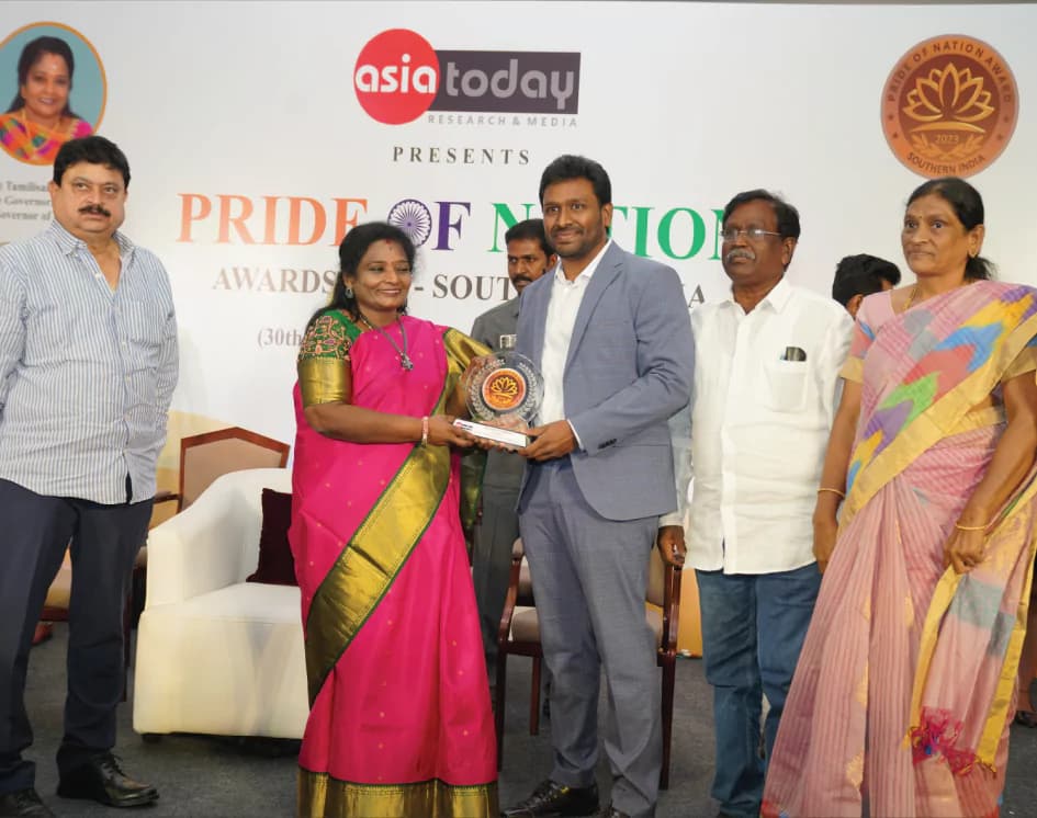 Dr Karuna Kumar receiving the Pride of the Nation Award from the Governor of Telangana, 2023